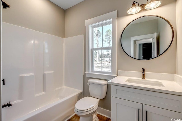 full bathroom featuring toilet, vanity, and shower / washtub combination