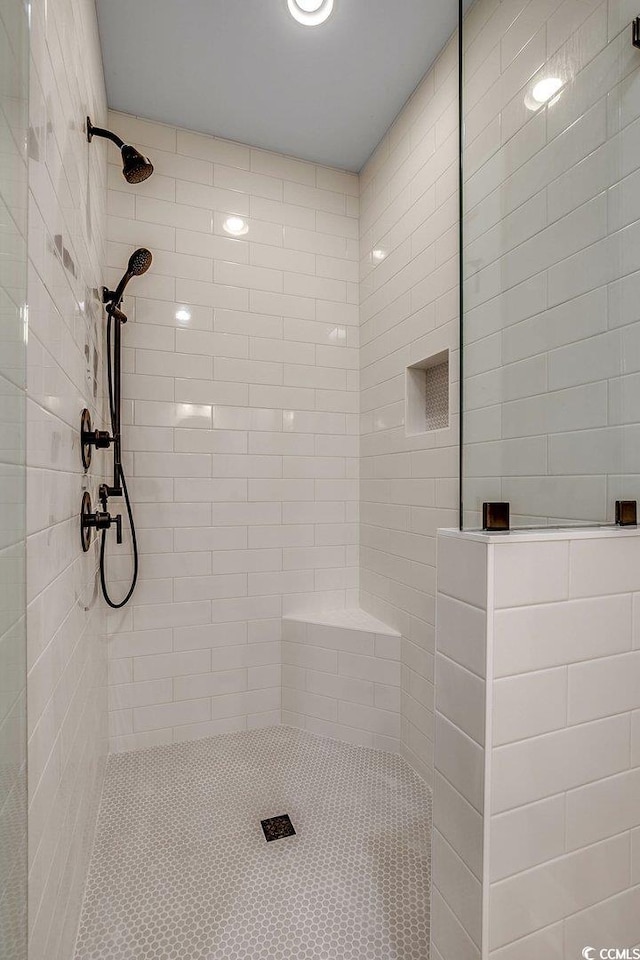 bathroom with a tile shower