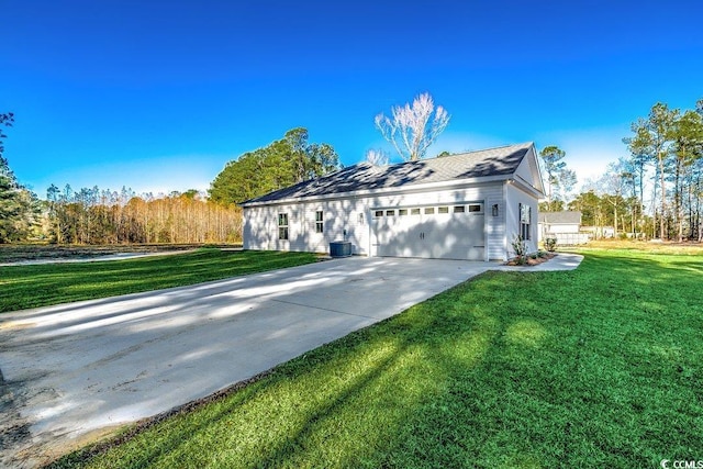 view of front of property featuring a front lawn and a garage