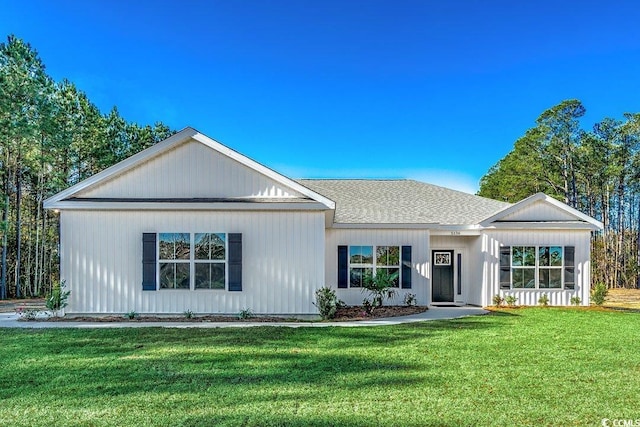 ranch-style house featuring a front lawn