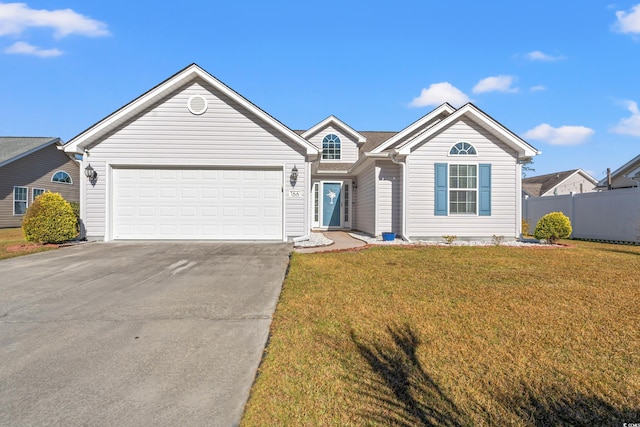 ranch-style home with a garage and a front lawn