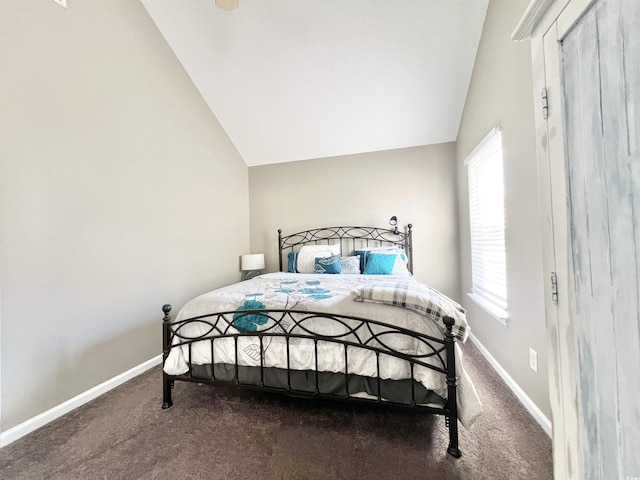 bedroom featuring carpet floors and vaulted ceiling