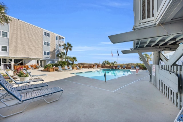 view of swimming pool with a patio area