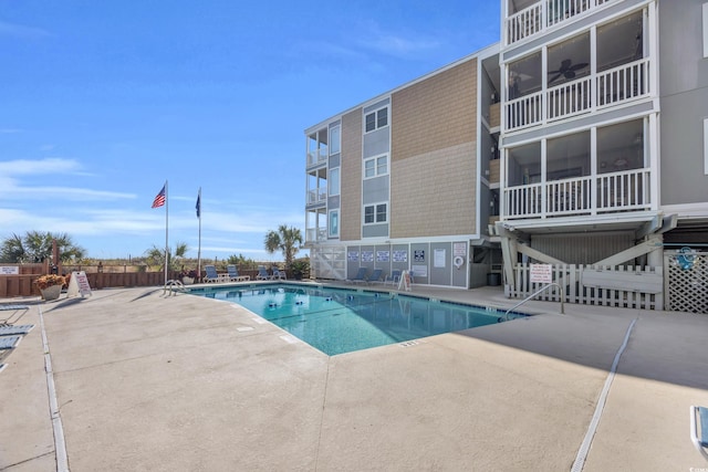 view of pool featuring ceiling fan and a patio