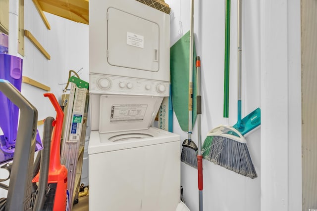 laundry area featuring stacked washer / dryer