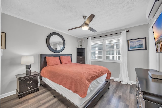 bedroom featuring crown molding, dark wood-type flooring, and a textured ceiling