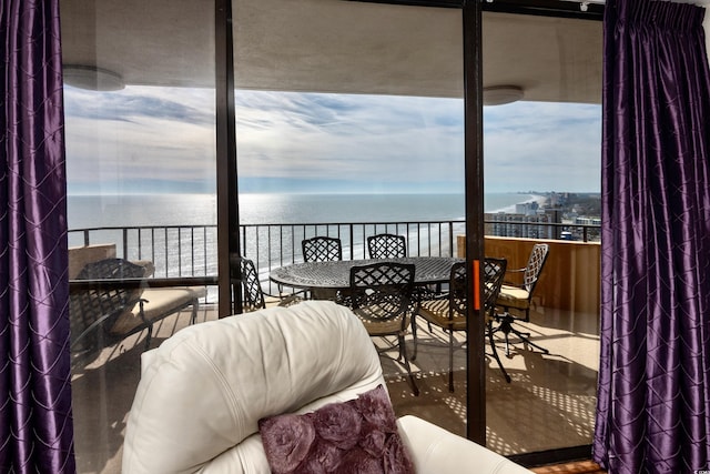 balcony featuring a water view