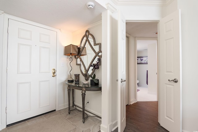 entryway with a textured ceiling