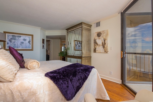 bedroom featuring crown molding and light hardwood / wood-style floors