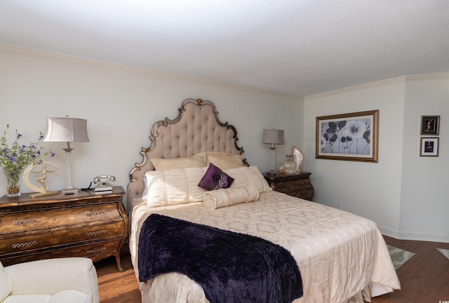 bedroom with wood-type flooring and ornamental molding