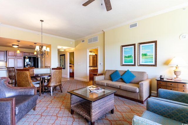 living room with ceiling fan with notable chandelier and crown molding