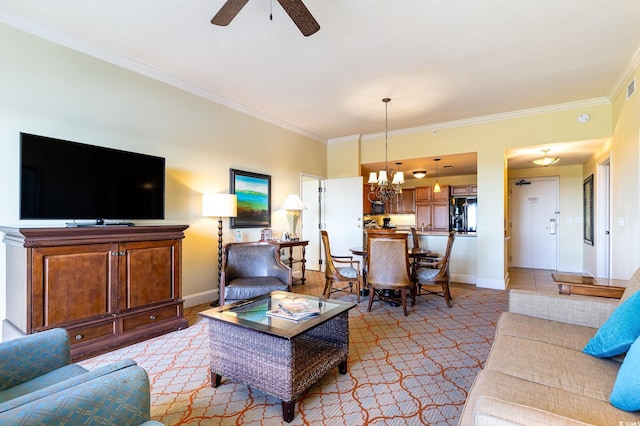 living room with ceiling fan with notable chandelier and crown molding