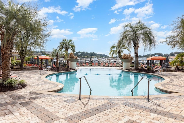 view of swimming pool featuring a gazebo and a patio area