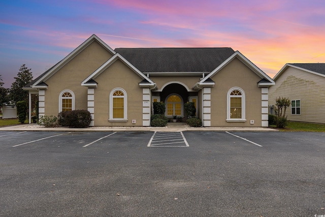 view of outdoor building at dusk