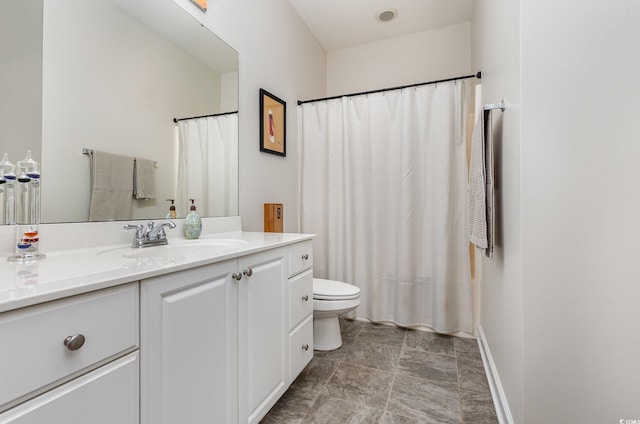 bathroom with toilet and vanity