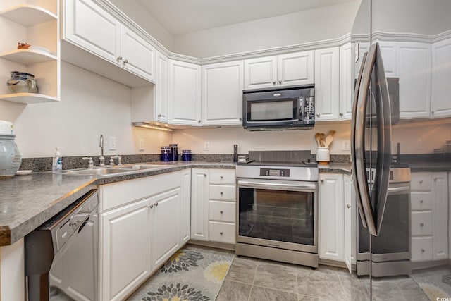 kitchen featuring white cabinets, black appliances, and sink