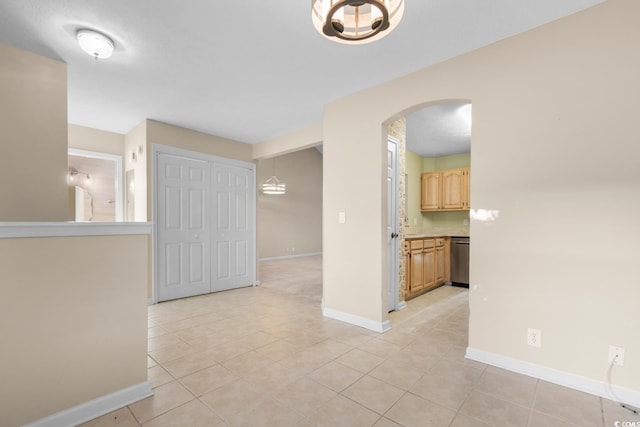 unfurnished room with light tile patterned floors