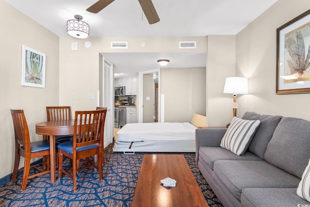 living room with ceiling fan