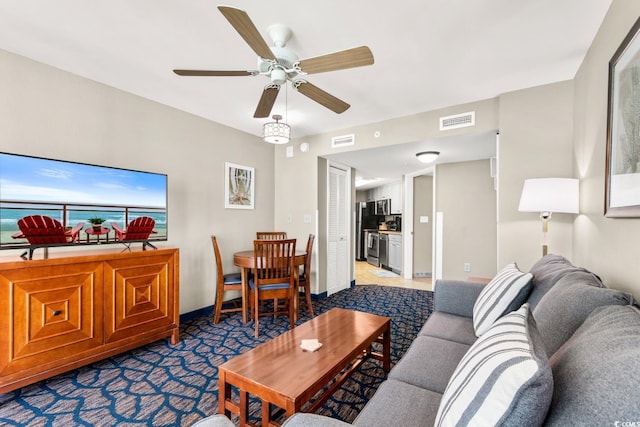 living room with carpet and ceiling fan