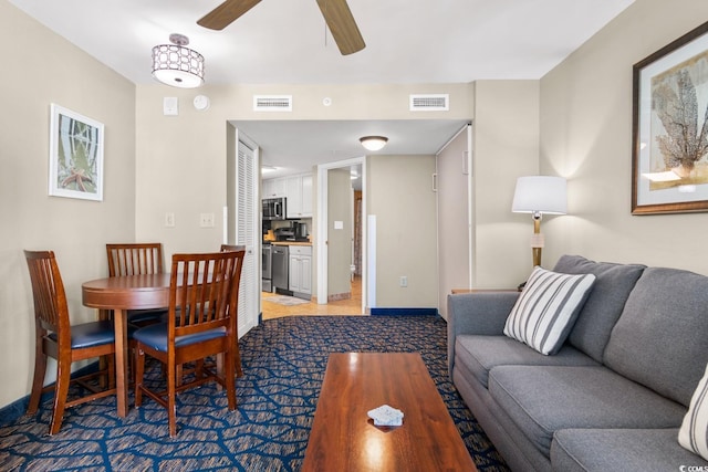 living room with ceiling fan