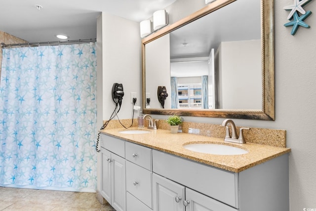 bathroom featuring a shower with shower curtain, vanity, and tile patterned floors