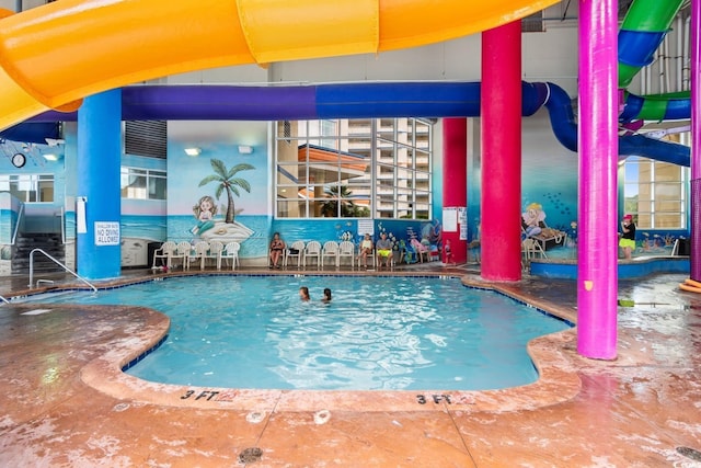 view of swimming pool featuring a water slide