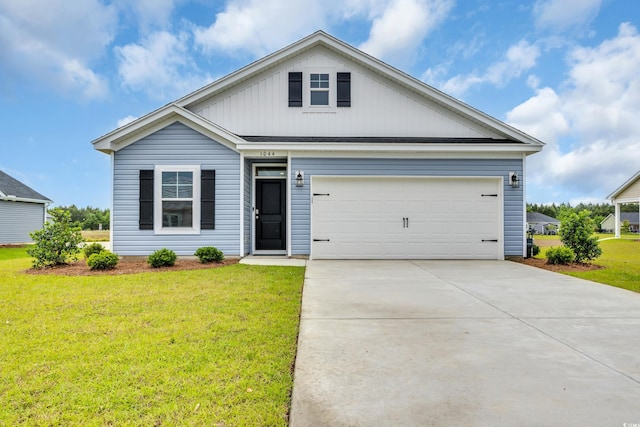 view of front of home with a front lawn and driveway