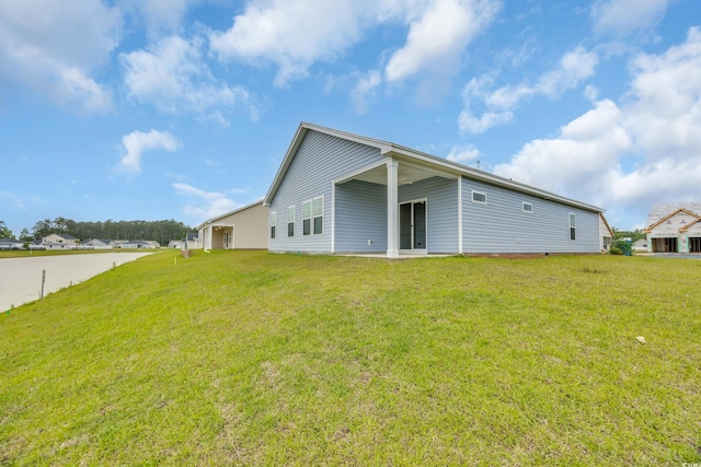 back of property with a yard