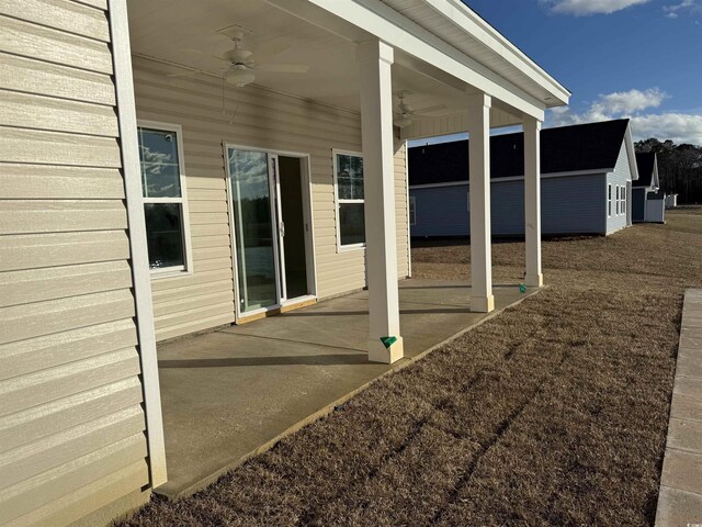 view of patio featuring ceiling fan