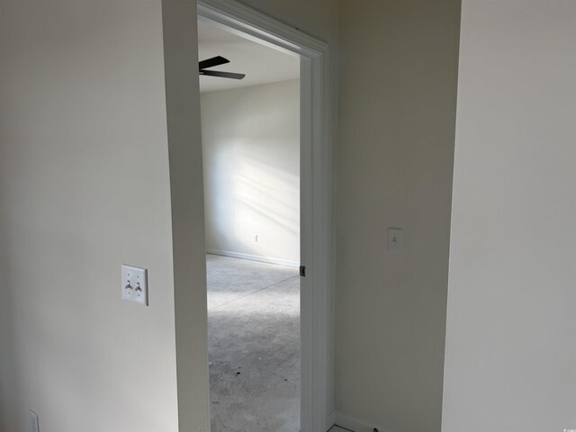 corridor featuring concrete floors