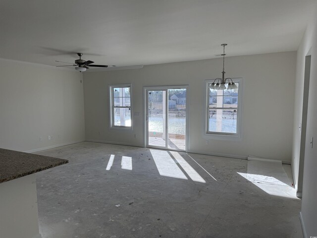 unfurnished dining area featuring ceiling fan with notable chandelier