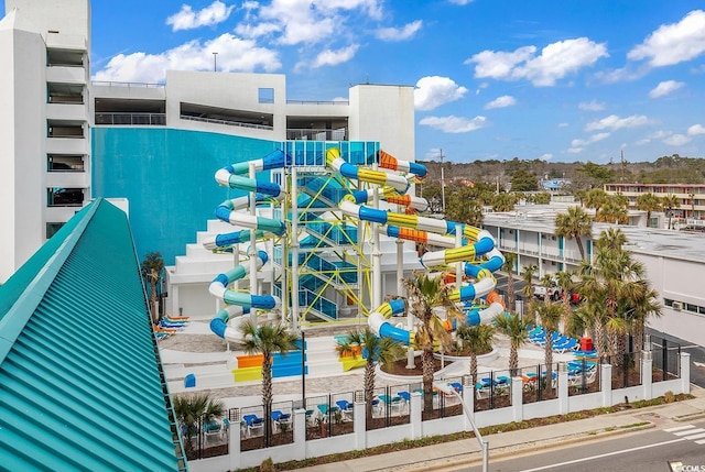 view of swimming pool featuring a playground