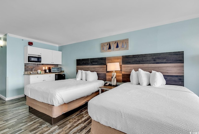 bedroom with crown molding and wood-type flooring