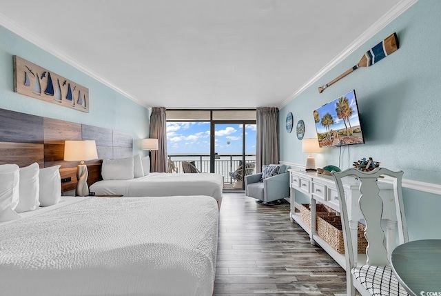 bedroom with crown molding, a wall of windows, hardwood / wood-style floors, and access to outside