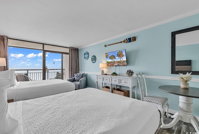 bedroom featuring crown molding, access to exterior, and hardwood / wood-style flooring