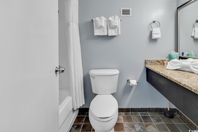 full bathroom featuring vanity, toilet, and shower / tub combo