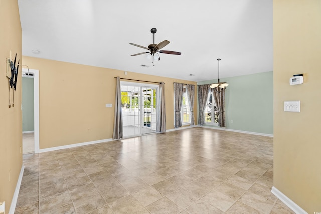 unfurnished room with ceiling fan with notable chandelier