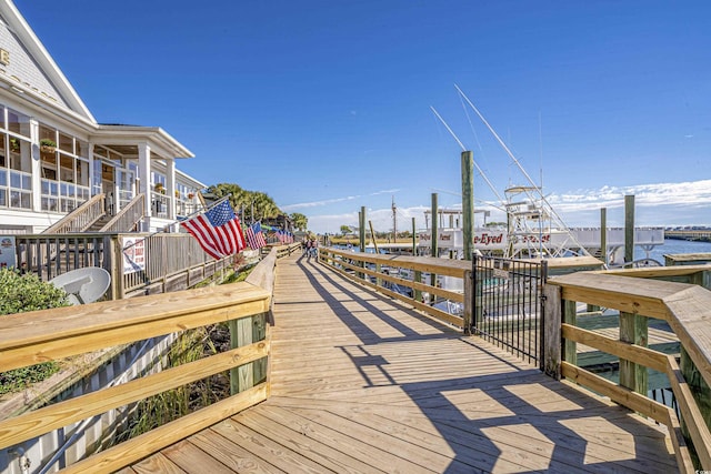 exterior space with a boat dock and a water view