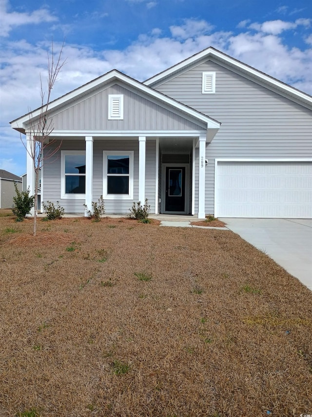 view of front facade with a garage and a front lawn