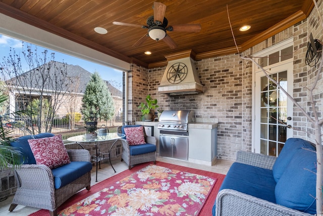 view of patio / terrace featuring outdoor lounge area, ceiling fan, a grill, and exterior kitchen