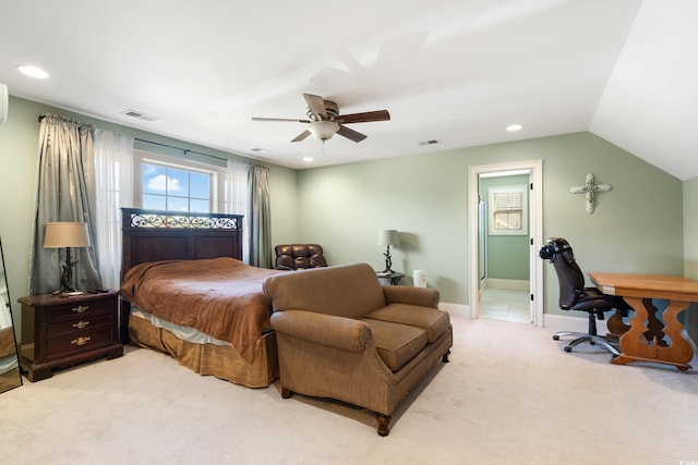 carpeted bedroom with ceiling fan and vaulted ceiling