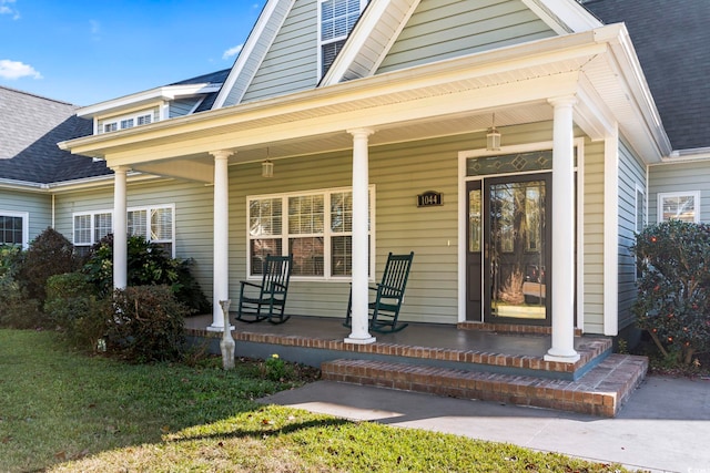 view of exterior entry with covered porch