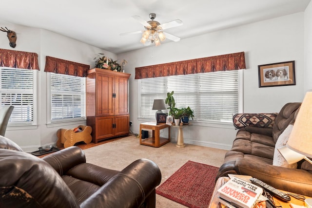 living room featuring ceiling fan and light colored carpet