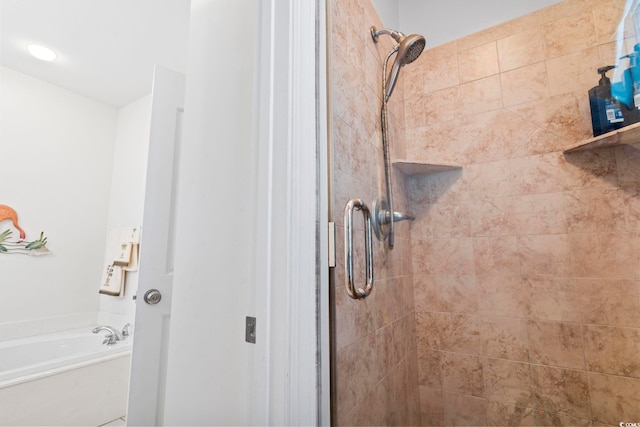 bathroom with separate shower and tub