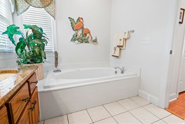 bathroom featuring a bath, vanity, and tile patterned floors