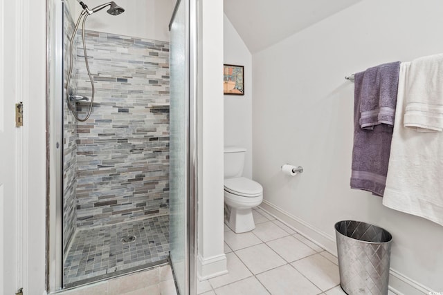 bathroom with tile patterned floors, an enclosed shower, vaulted ceiling, and toilet