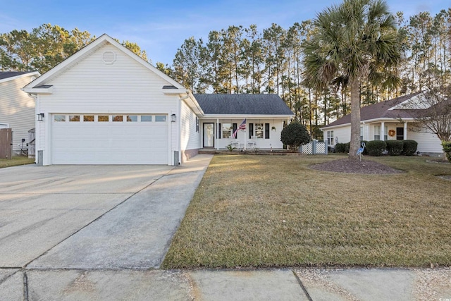 ranch-style house featuring a porch, a garage, and a front lawn