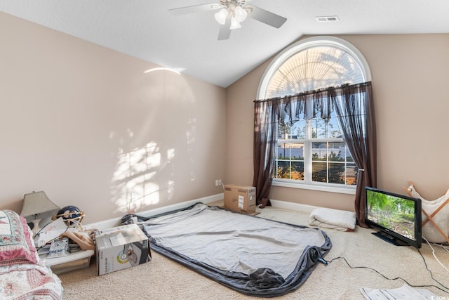 carpeted bedroom with ceiling fan and lofted ceiling