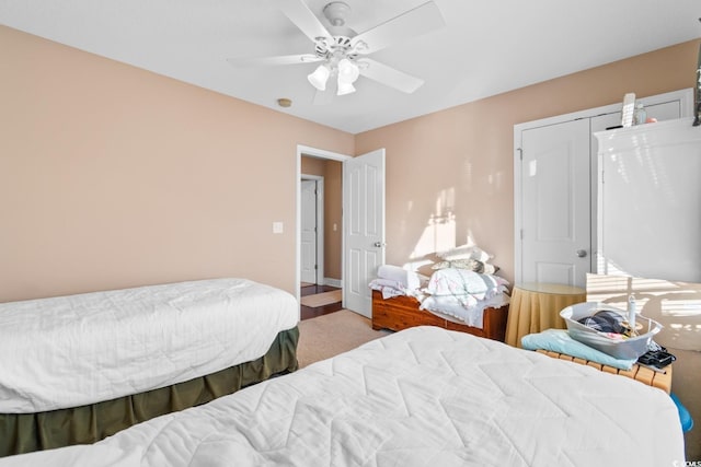 carpeted bedroom with ceiling fan