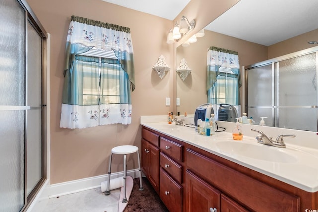 bathroom with vanity and walk in shower